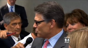 Covering Gov. Rick Perry in NH campaigning on the day he was arraigned on two felony counts of abuse of power