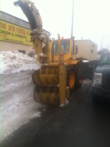 A twelve-foot, 15-hundred dollar an hour snow blower Saturday churned up snow banks along Massachusetts Avenue in the Dorchester neighborhood of Boston.