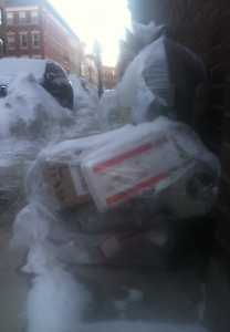 Bags of garbarge litter the North End of Boston while extra crews working overtime clean up the mess left over after six to seven feet of snow in a three week period.