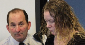 A court officer in Middlesex Superior Court in Woburn, MA escorts Aisling Brady McCarthy during a pre-trial hearing (Courtesy of The Irish Times via Wendy Maeda:The Boston Globe via Getty Images)