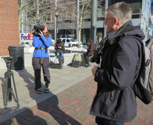 TV reporters outside the federal courthouse in Boston