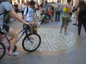 Tourists gather at a commemorative site marking the Boston Massacre