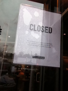 Sign in the window at Chipotle in Boston closed Tuesday