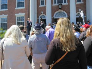 Trump supporters outside Braintree Town Hall organize for the caucus